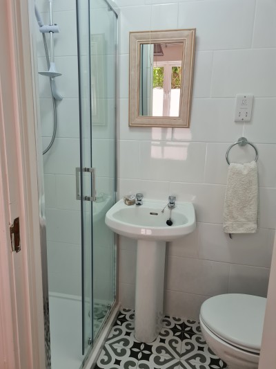 En-suite shower room in the ground floor apartment at Árasáin Bhalor - 4 Star Self Catering Apartments & House, Falcarragh, County Donegal, Ireland